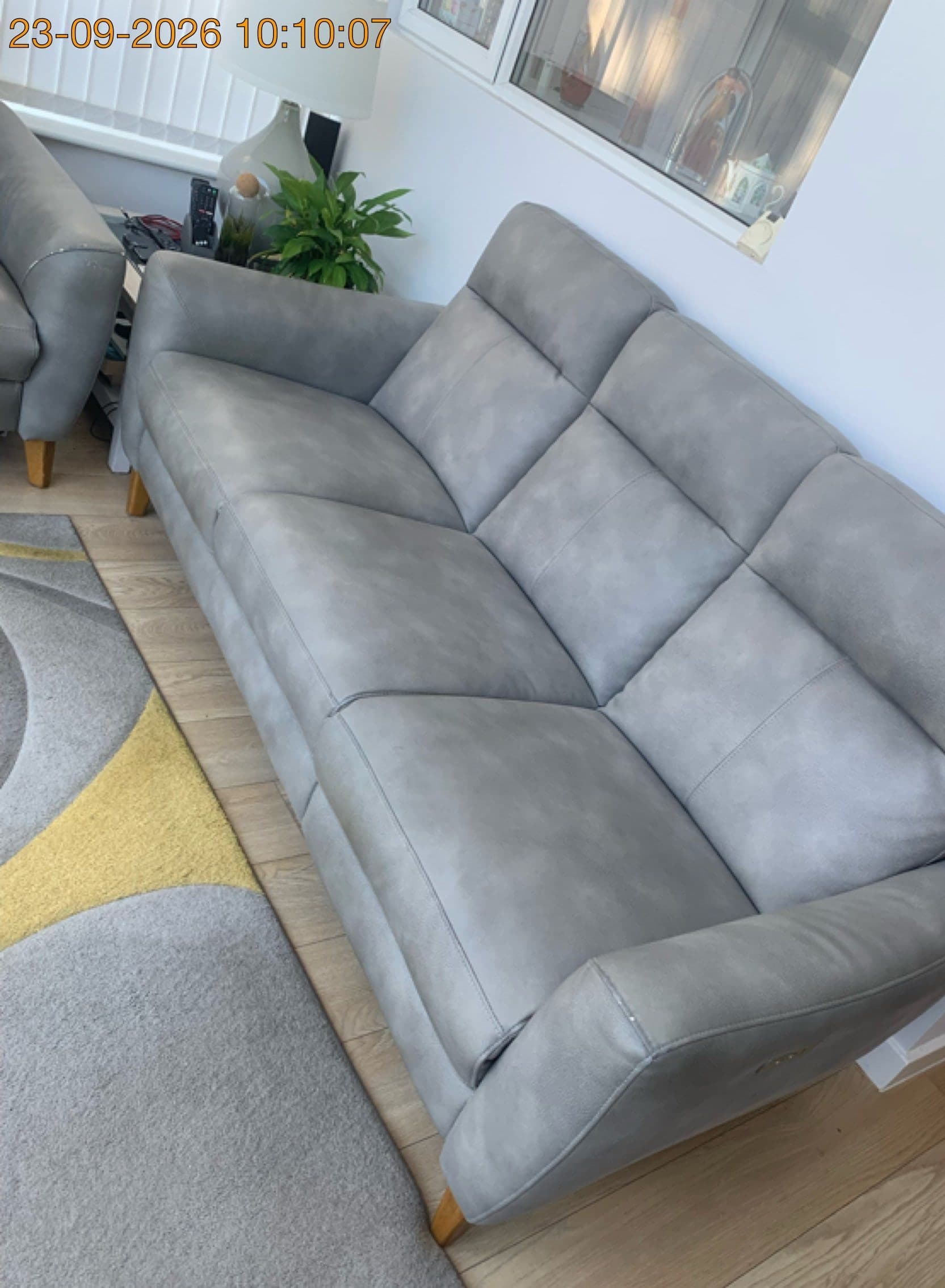 Grey 3-seater sofa in the same lounge on Sussex Road, Bletchley, before removal