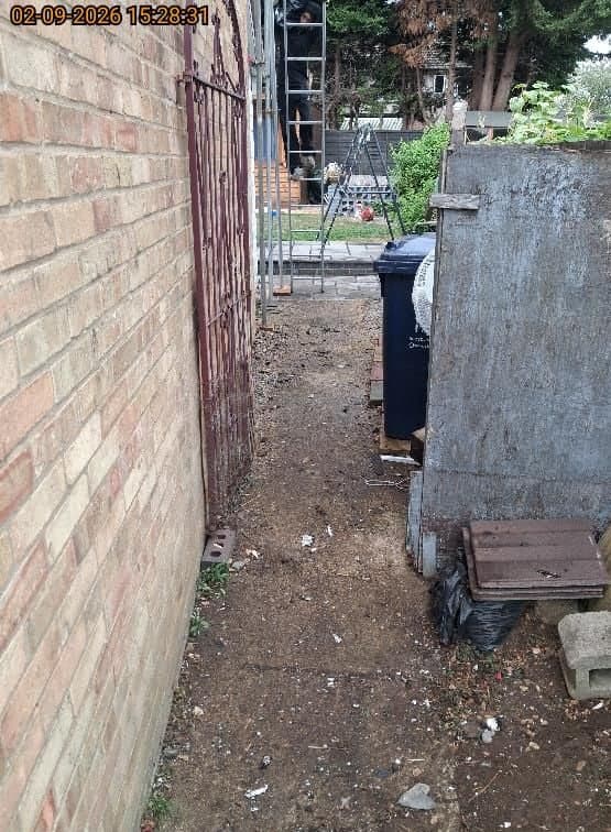 The same Headington side passage swept clean and clear after the roofing waste was removed