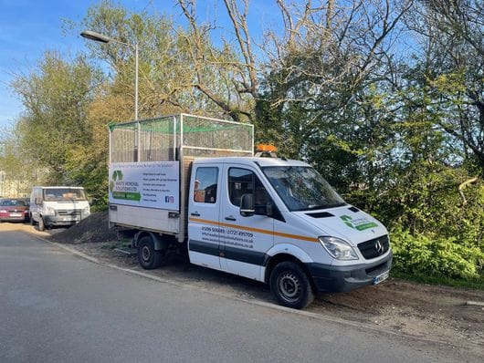 A Waste Removal Solutions crew loading a collection vehicle